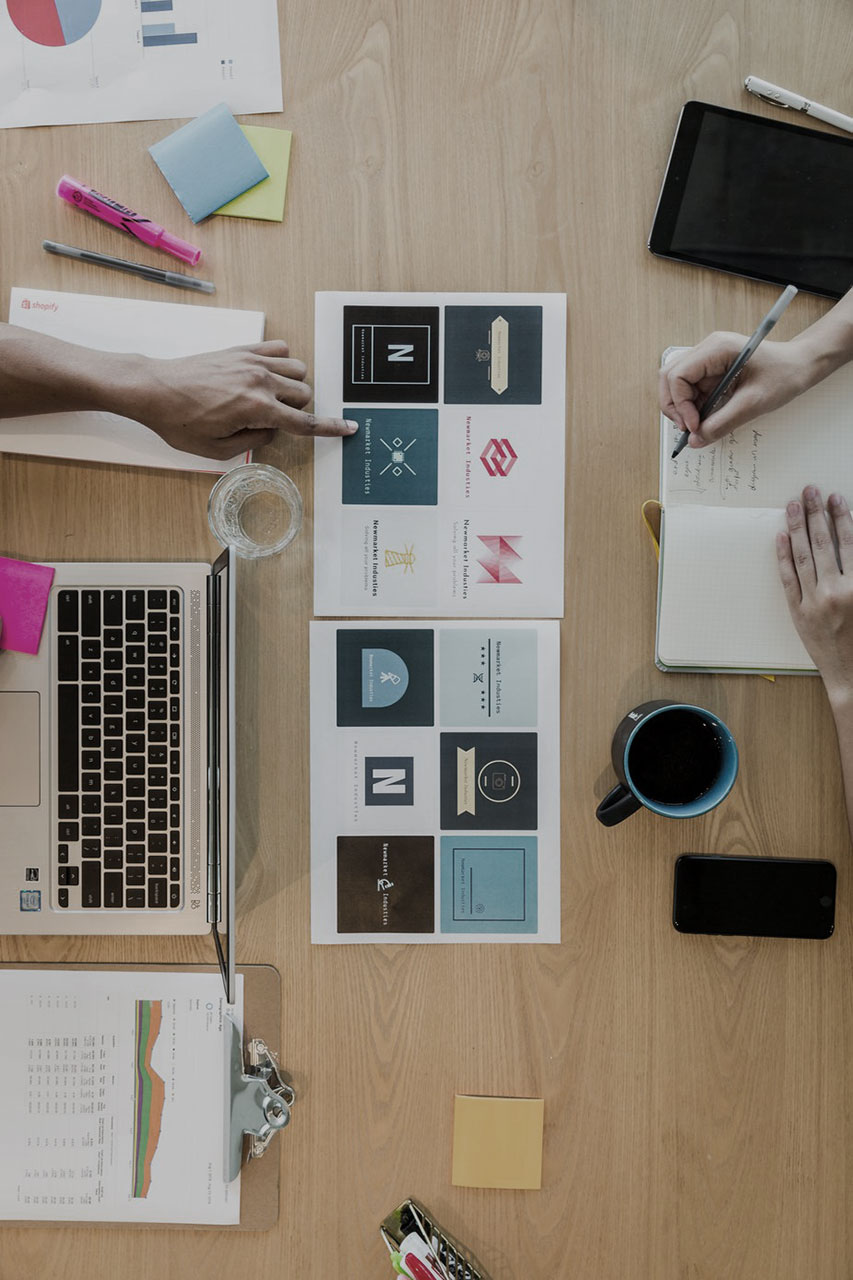 Graphic designers designing a logo